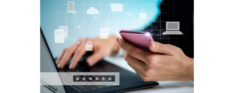 User on a phone and laptop